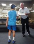Caleb Donaldson accepts the JAB A Grade Winners Certificate for Waihi School