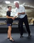 Jordy Sew Hoy with the winning certificate for JAB B Grade for Waimate blue